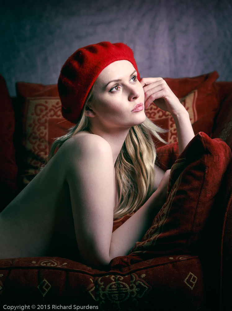 Portrait Photography - Portrait Photographer - colour image of the subject looking up towards the light wearing a red beret