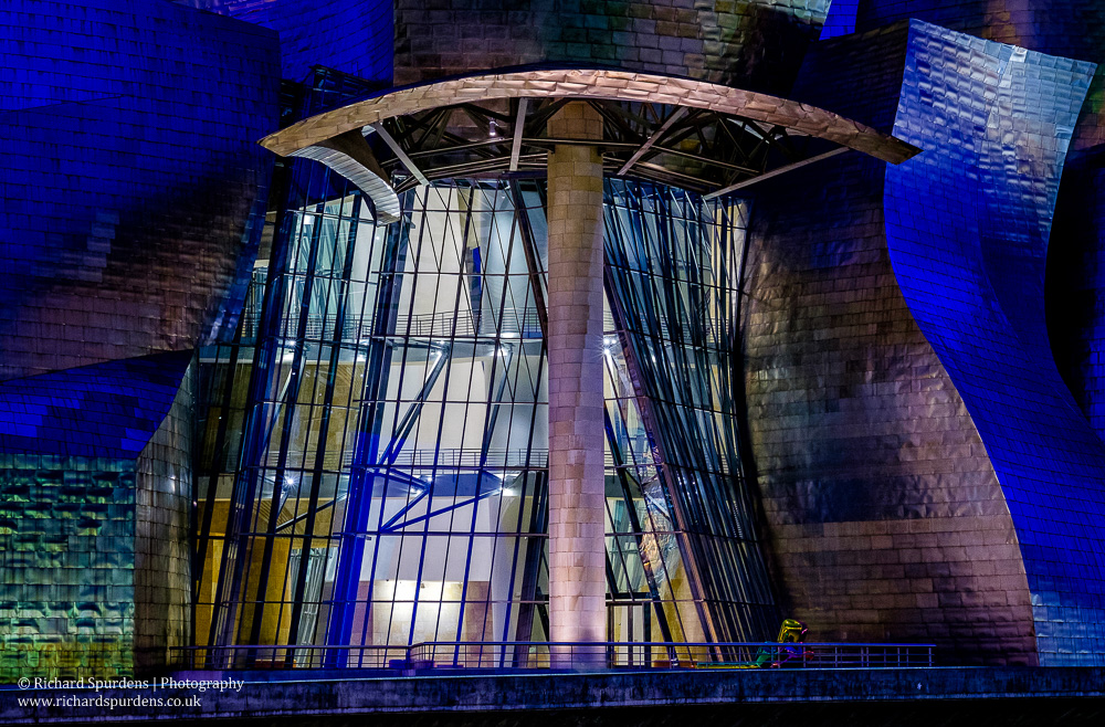 Architecture Photography - Architecture Photographer - glass and steel exterior of the guggenheim museum Bilbao at night