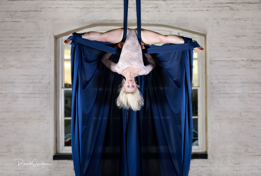 aerial arts photography - aerial arts photographer - aerialist inverted hanging from bue siks
