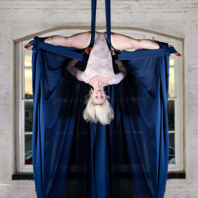 aerial arts photography - aerial arts photographer - aerialist inverted hanging from bue siks