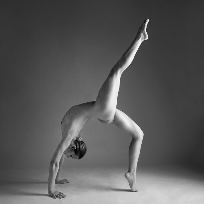 Fine Art Nude Photography - Fine Art Nude Photographer - Mono image of alya rose making a arched shape from a handstand. From a sudio session at the Loft Studio,