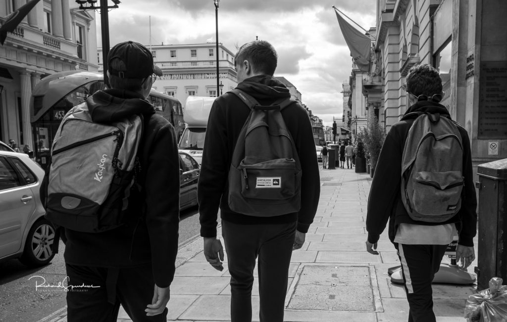 street photography - street photographer - walkers with back packs