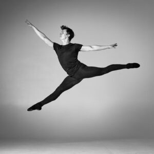 Dance Photographer - Dance photography - male dancer leaping acros the stage