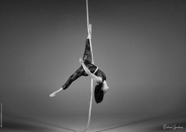 aerial arts photography - aerial arts photograher - aerial artists hang upside down from a vertically suspended rope