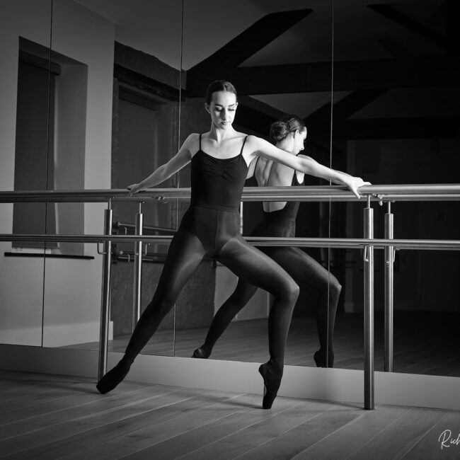 dance photographer - dance photography - dancer working with the barres and her reflection in mirror