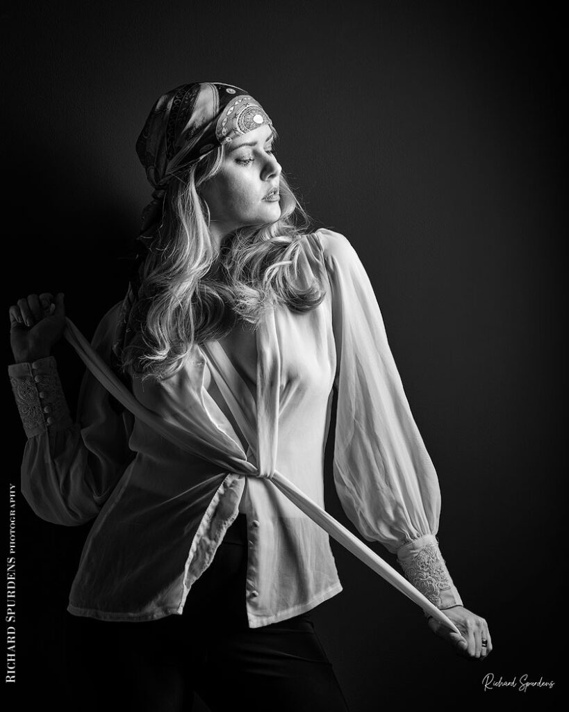 fashion photography fashion photographer - monochrome image of model wearing a white blouse and patterned bandana