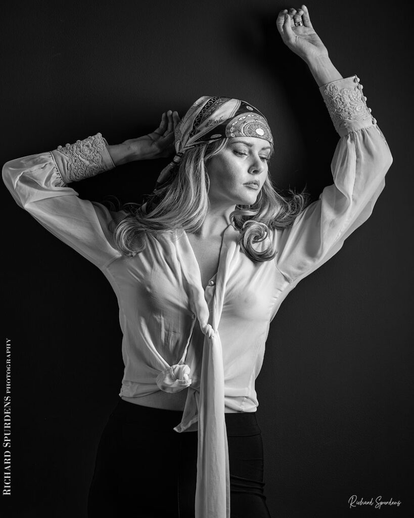 fashion photography fashion photographer - monochrome image of model wearing a white blouse and patterned bandana