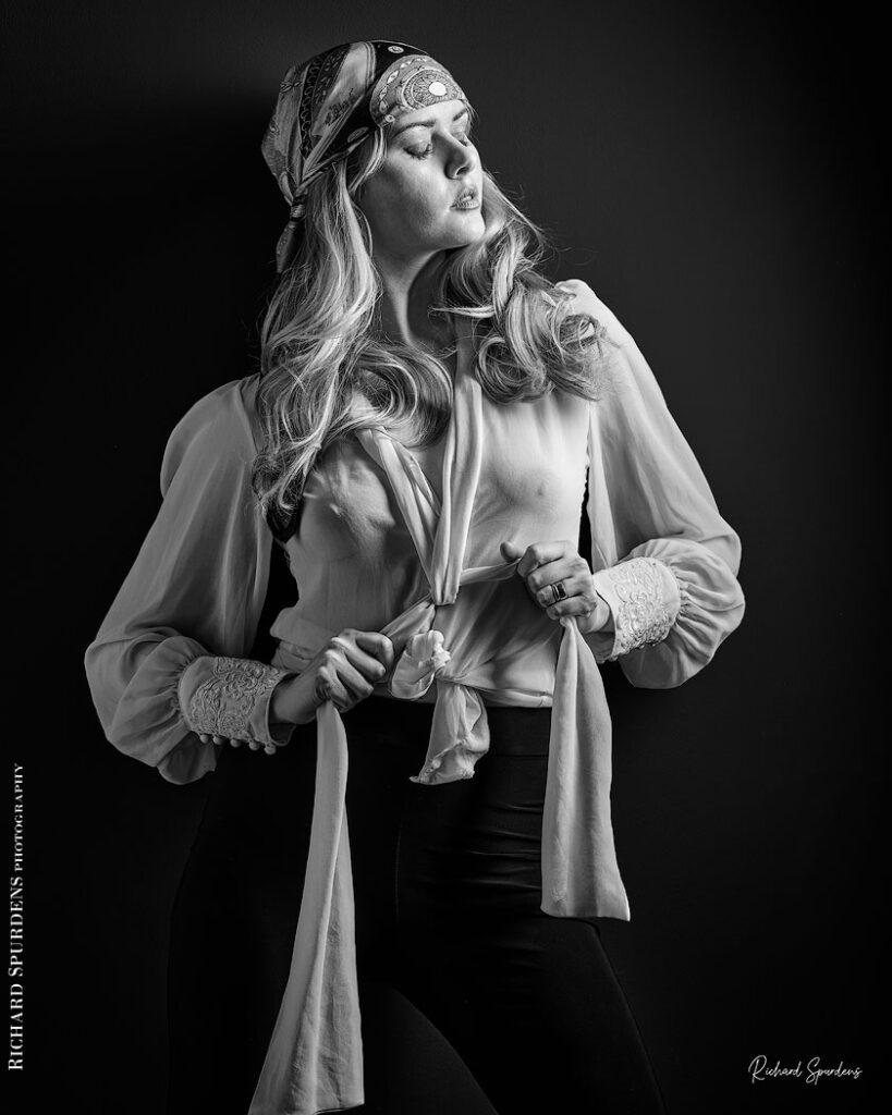 fashion photography fashion photographer - monochrome image of model wearing a white blouse and patterned bandana