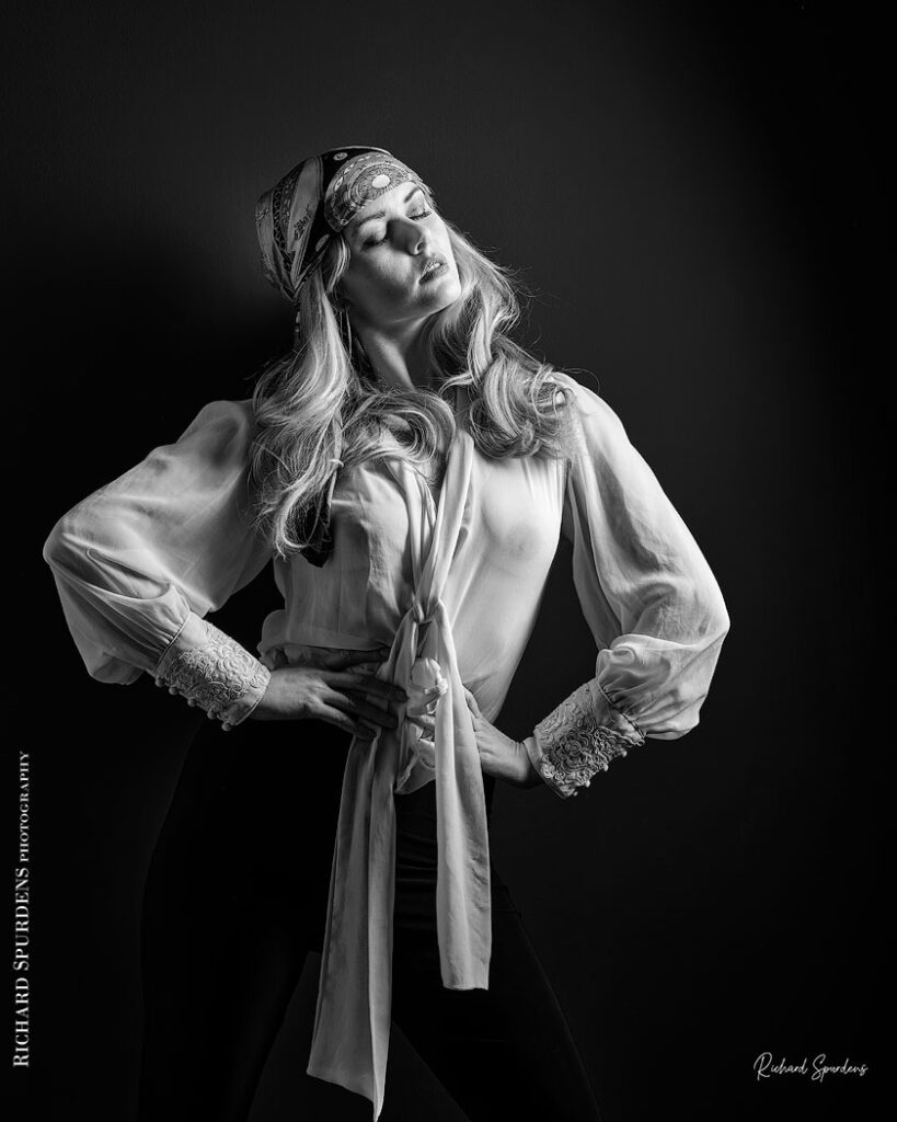 fashion photography fashion photographer - monochrome image of model wearing a white blouse and patterned bandana