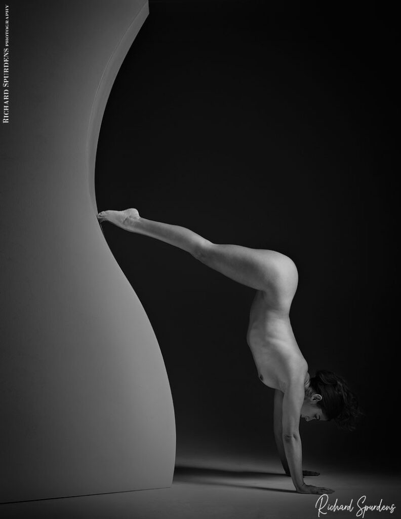 fine art nude photography- fine art nude photographer - handstand on a curved wall section