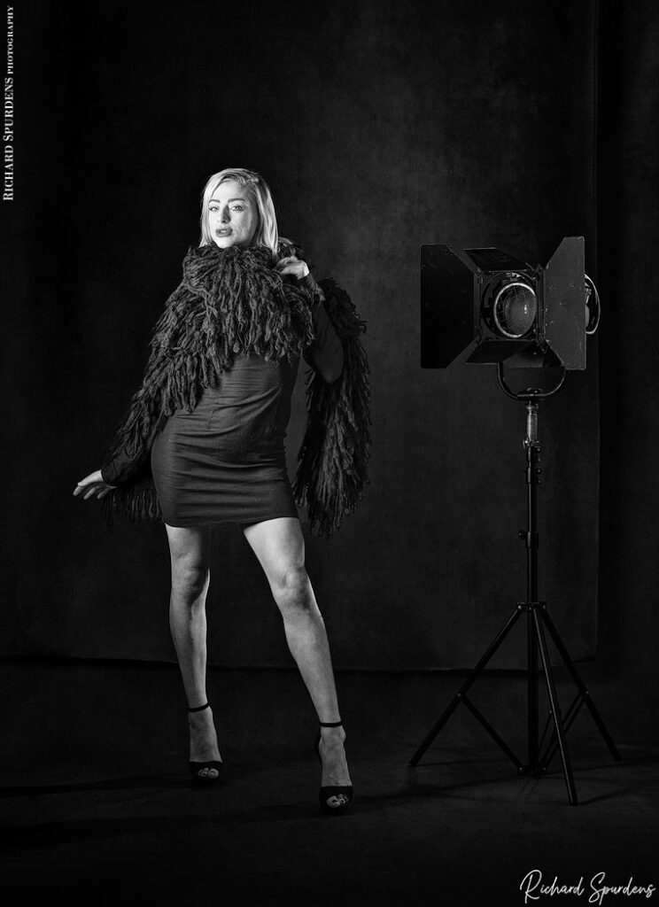 fashion photography fashion photographer - holly wood lighting model poseing next to an old studio light