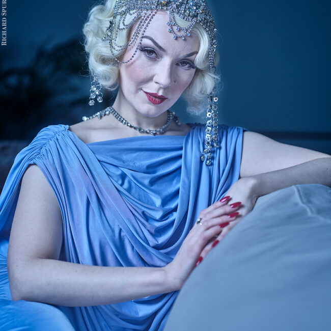 fashion photography, fashion photographer - headshot of showgirl fwearing a blue dress and tiara